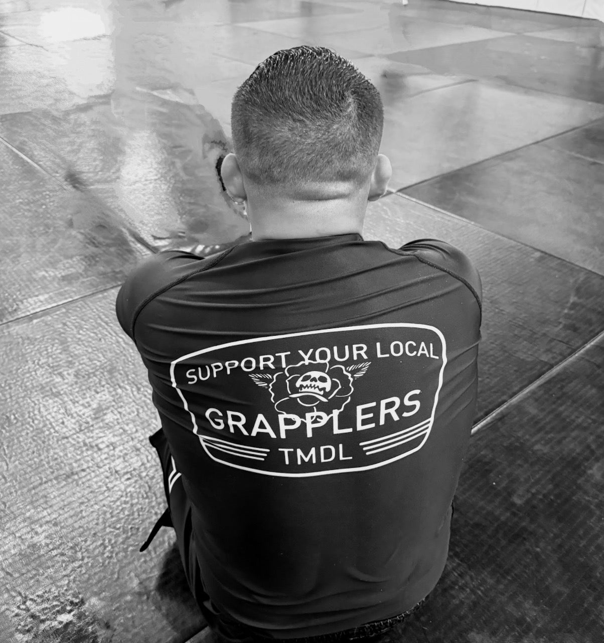 “Support your local” rashguard. “PREORDER ONLY”